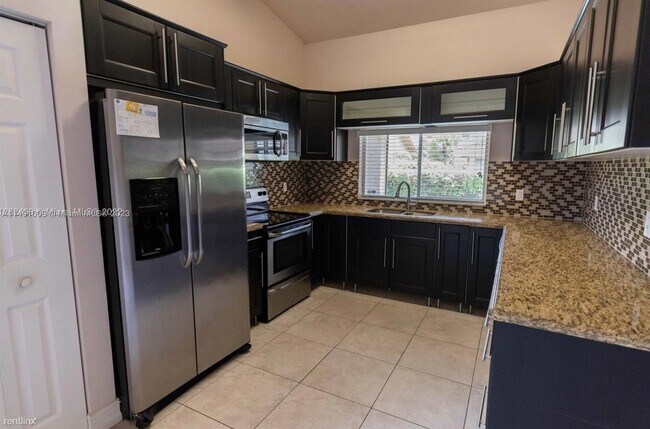Foto del edificio - 3 br, 2 bath House - 10428 NW 9th Mnr # 10428