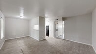 This 2-bedroom, 1-bathroom unit at 2730 Lafferty Rd in Pasadena, TX offers a well-organized, single-floor layout designed for comfortable everyday living. The open-concept living room and kitchen area provides a seamless flow between spaces, with durable wood-look flooring in the kitchen and entryway transitioning to plush neutral carpet in the living and bedroom areas. The galley-style kitchen is thoughtfully appointed with crisp white cabinetry, granite-style countertops, a stainless steel double-basin sink, a dishwasher, an electric range, and a full-size refrigerator, offering ample storage and prep space. The spacious primary bedroom features soft carpeting, a window with natural light, and a dedicated closet with built-in shelving and a hanging rod for organized storage. The second bedroom is similarly appointed with carpet flooring, a window overlooking the surroundings, and its own closet with double doors. The full bathroom includes a granite-top vanity with white cabinetry, a mirror, wood-look tile flooring, and a full tub-shower combination. Neutral tones and clean finishes throughout lend the space a bright, move-in-ready aesthetic.