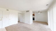 Located at 42 N Lawndale Ave in Indianapolis, IN, this two-bedroom, one-bathroom residence offers a practical and comfortable single-floor layout. The living area is generously proportioned, featuring warm neutral carpet throughout, bright white walls, and a ceiling fan. A sliding glass door floods the space with natural light and opens to an outdoor view, while louvered closet doors add a classic touch. The open layout connects the living area seamlessly to the kitchen, which is outfitted with warm wood cabinetry, tile flooring, track lighting, a black refrigerator, dishwasher, and a gas range — providing a fully functional cooking space. The primary bedroom is a well-sized retreat with plush carpet, a natural light window, and access to a dedicated closet space. The second bedroom mirrors this comfortable design with its own carpeted floors and a bright window. The shared full bathroom features clean white tile surrounding a full-size tub and shower combo, tile flooring, and a vanity with storage. Two hallways connect the rooms efficiently, contributing to a logical and easy-to-navigate floor plan. Overall, the unit offers a clean, move-in ready environment well-suited for everyday living in a convenient Indianapolis location.