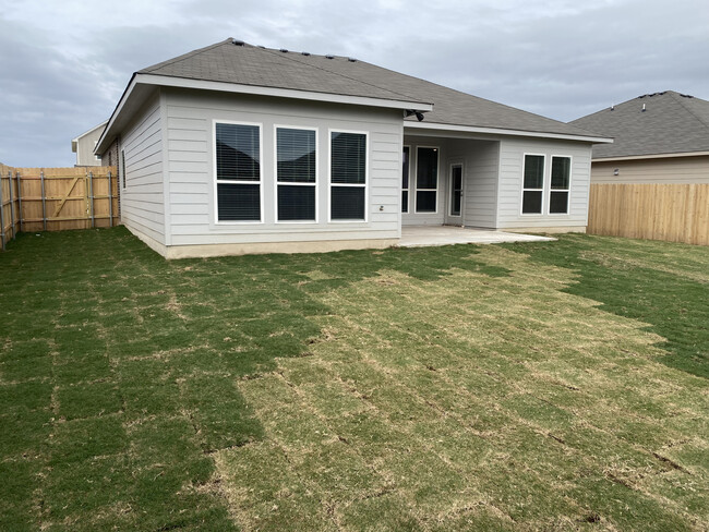 Backyard with Extended Patio. - 10231 Six Shooter Ln