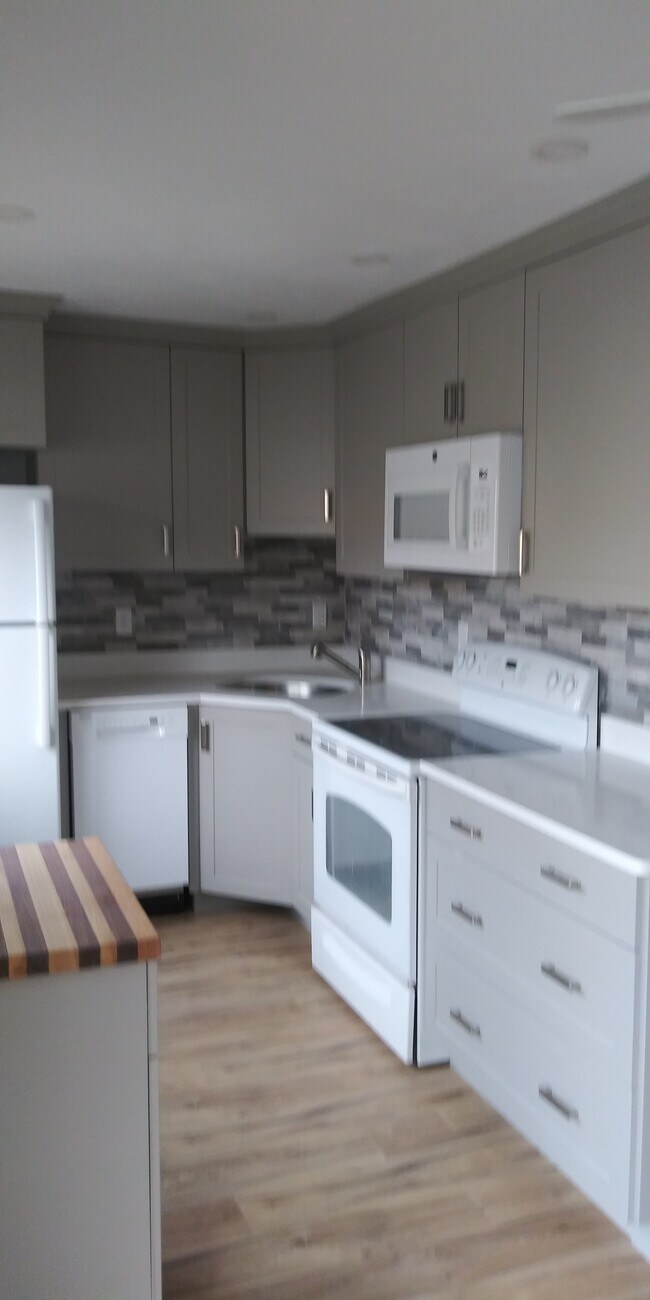 Small island, on wheels, with butcher block top. - 16 Appleton Park