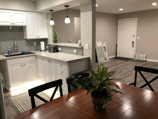 from the dining room looking into kitchen and living room - 6901 Alvarado Rd