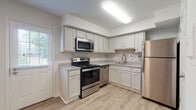 Located at 2637 Sawbury Blvd in Columbus, Ohio, this two-floor property offers a thoughtfully arranged layout with updated finishes throughout. The kitchen is a standout feature, showcasing white cabinetry, granite-look countertops, a tile backsplash, and a full suite of stainless steel appliances, including a range, microwave, dishwasher, and refrigerator. Light wood-style flooring runs through the main level, contributing to a clean, bright aesthetic that is complemented by natural light from multiple windows. The living area on the main floor is open and airy, with a textured ceiling and neutral white walls that provide a versatile backdrop. A staircase with a handrail connects the two floors, leading to the upper level where carpeted bedrooms offer a comfortable, softer finish underfoot. The upper-level hallway opens to multiple rooms, each with neutral walls and windows that bring in natural light. Bathrooms are finished with brushed nickel hardware accents. Throughout the home, clean white walls, consistent trim work, and a neutral color palette create a cohesive and move-in-ready atmosphere well-suited for a variety of lifestyles.