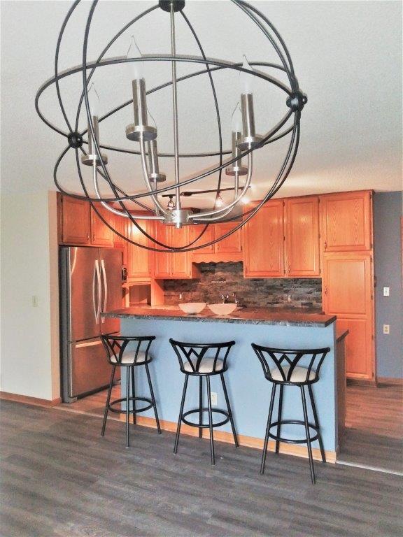 kitchen with bar island - 445 Lakota Ln