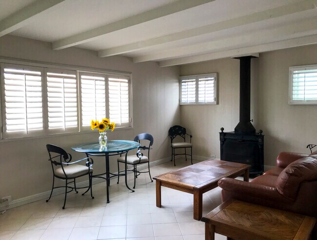 Tiled floors and countertops. Vintage gas fireplace - 216 Onyx Ave