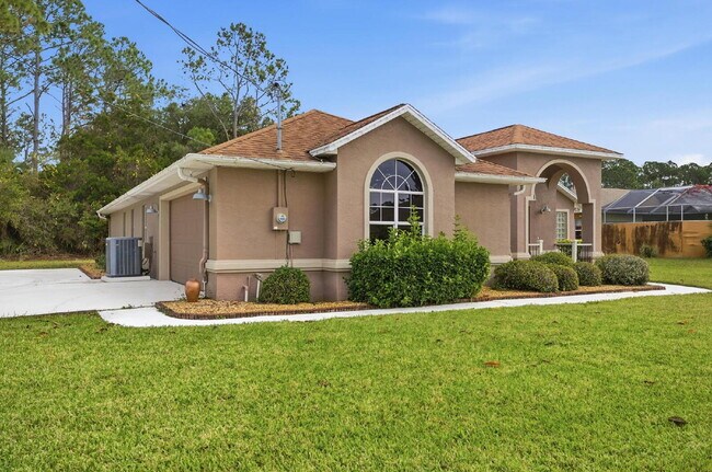 Building Photo - "Charming 3-Bedroom Home with 2 Full Baths and 2032 Sq Ft of Comfort in Palm Coast!"