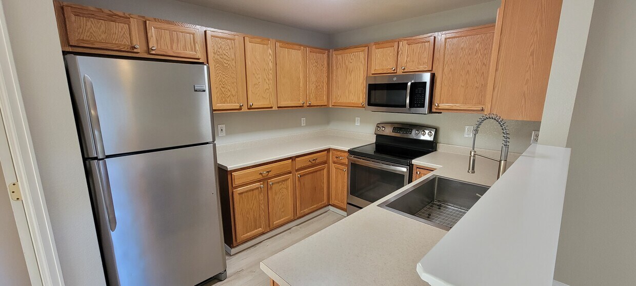 Stainless Steel Appliances with professional style chef's sink - 2141 Legacy Ridge Vw