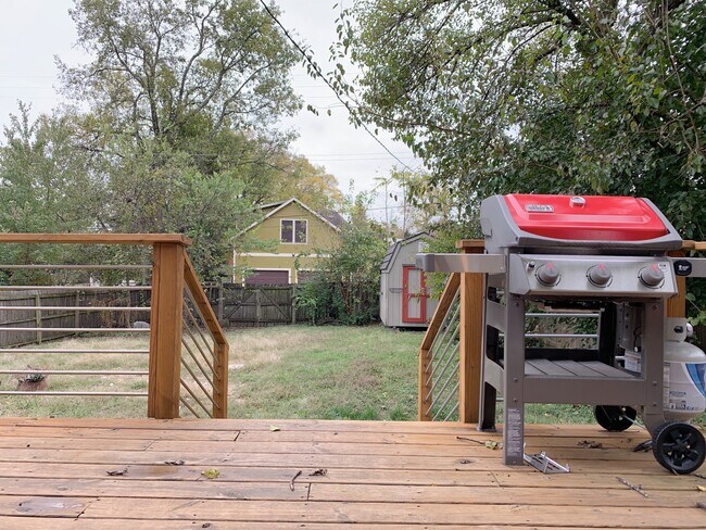 Deck looks out on a huge yard with storage shed. - 1202 Forrest Ave