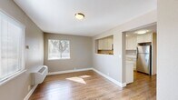 This 620 square foot apartment in Walnut Creek offers a thoughtful layout with two bedrooms and one bathroom. The primary bedroom measures 120 square feet, providing ample space for a comfortable retreat. The open-concept design combines the kitchen and living room, creating a sense of spaciousness in the compact floor plan.

The kitchen boasts modern amenities, including stainless steel appliances, white cabinetry, and a convenient over-the-range microwave. The L-shaped counter layout maximizes workspace efficiency. Adjacent to the kitchen, the living area features warm wood-look flooring and large windows that invite natural light, enhancing the room's ambiance.

Both bedrooms are carpeted for comfort and equipped with sliding closet doors for storage. The bathroom showcases a clean, contemporary design with a combined tub and shower unit. Throughout the apartment, neutral tones on the walls create a versatile backdrop for various decor styles.

Climate control is provided by wall-mounted units, ensuring year-round comfort. The apartment's design emphasizes functionality and modern aesthetics, making efficient use of its 620 square feet to create a cozy yet practical living space.