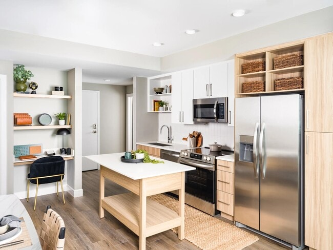 An open kitchen at Modera McGavock, featuring upscale finishes and flexible space, with quick access to Nashville’s dining, music, and everyday essentials. - Modera McGavock