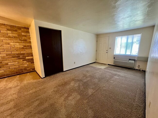 Photo - Cozy One Bedroom Apartment! Exposed Brick throughout & Laundry On-Site! Call Today!
