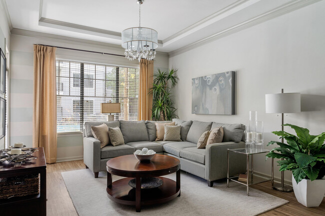 Step into this elegantly designed living room, where comfort meets chic modernity. - Rowe Vinings