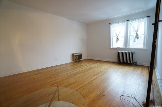 Building Photo - 64-12-64-48 48th Ave