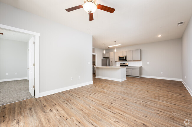 Portico - Living Room - The Village at Sandstone Apartments