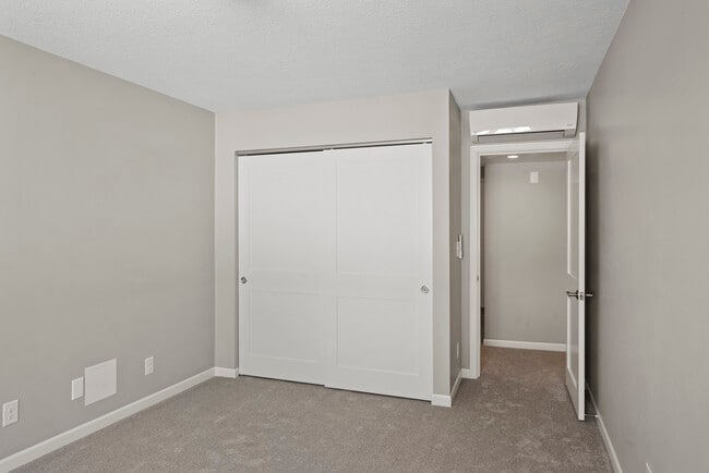 Second bedroom also with deck overlooking Lake Minnetonka - Minnetonka Edgewater Apartments and Boat Slips