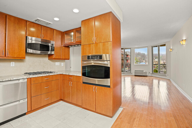 Updated kitchen, open into living room. - 50 E Hartsdale Ave