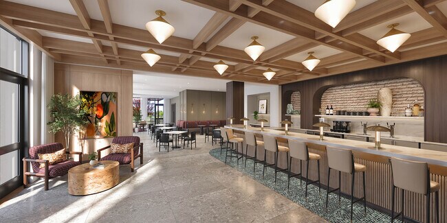 Cafetería en la primera planta con muchas mesas. - AMLI Treehouse