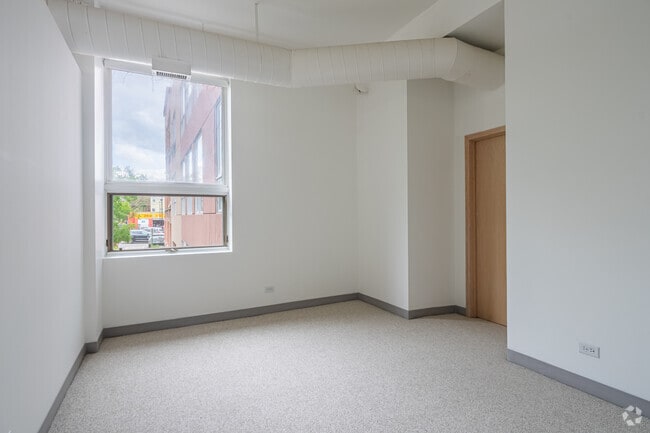 2BR, 1BA - 1,350SF - Primary Bedroom - Downer Place Lofts