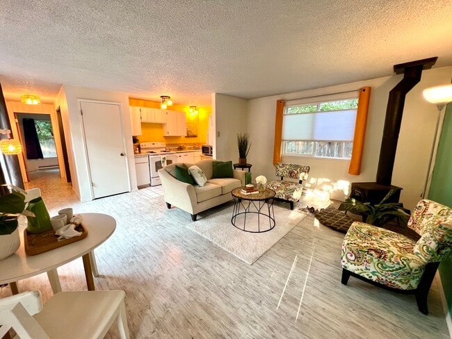 Living room and open kitchen and dining area. - 1614 Groves Ave NW