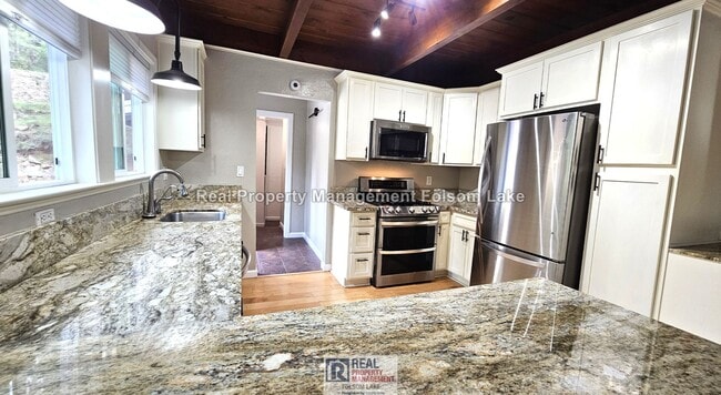 Building Photo - Private Wooded Retreat on 2 Acres – 4BR 2Bath Home with Space for Animals, Fruit Trees & Seasonal...