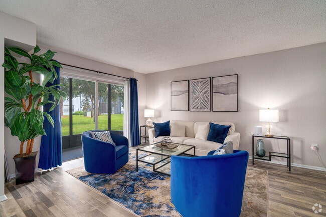 2BR, 2BA - 955SF - Living Room - Royal Isles Apartments