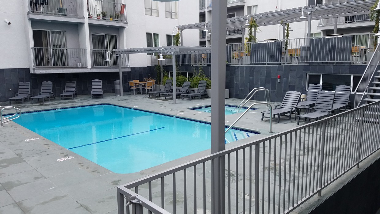 Sundeck, heated pool and hot-tub! - Sunset West Apartments