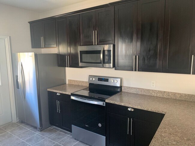 Building Photo - Remodeled three bedroom two bath home with...