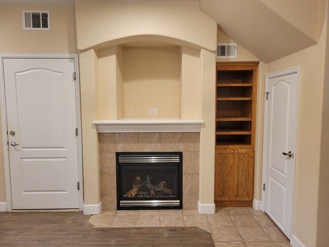 Fireplace, bookshelf & coat closet - 5775 W 29th St