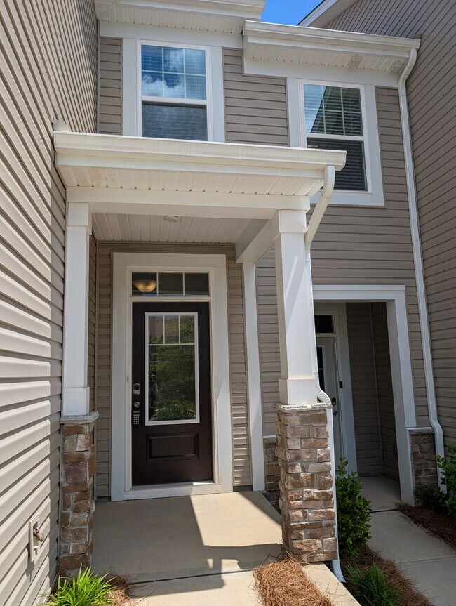 Building Photo - Elegant, Move In ready townhome located in...