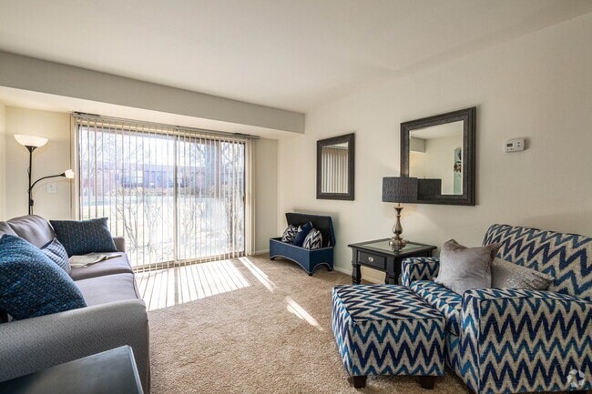 Spacious living room with natural light at Three Oaks Apartments in Troy, MI - Westwood Village Apartments