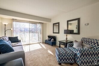 Spacious living room with natural light at Three Oaks Apartments in Troy, MI - Westwood Village Apartments