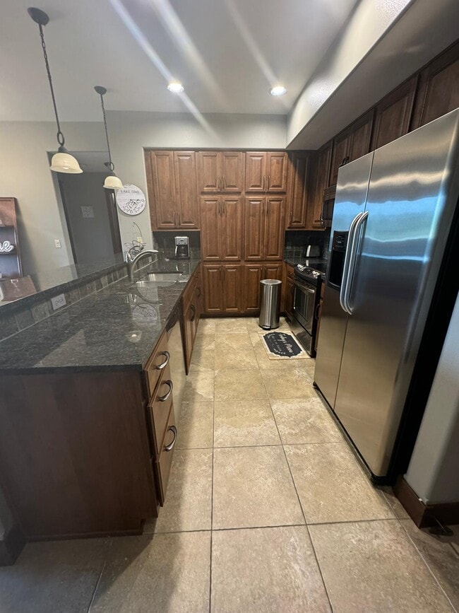 Building Photo - River Stone Condominium