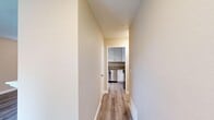 Located at 2529 Eastern Ave in Arden-Arcade, CA, this two-bedroom, three-bathroom home offers a thoughtfully updated interior with a clean, modern aesthetic. The living room serves as a welcoming centerpiece, featuring wood-look laminate flooring, a tiled fireplace, and sliding glass doors that open directly to a private, fenced backyard with a grassy area — ideal for outdoor relaxation. The kitchen is well-appointed with white shaker cabinetry, granite countertops, a stainless steel sink with a pull-down faucet, and stainless steel appliances including a range and dishwasher. Wood-look flooring continues through the kitchen and hallways, lending a cohesive, contemporary feel throughout. The primary bedroom includes a ceiling fan, wood-look flooring, and access to a bathroom outfitted with white cabinetry, granite countertops, and a large mirror with vanity lighting. An adjacent closet provides convenient storage. The secondary bedroom features plush carpet and a window with blinds for natural light and privacy. The bathrooms maintain a clean, modern finish, with one featuring a sleek sliding glass shower enclosure. Two hallways connect the spaces efficiently, and two closets offer additional storage throughout the home.