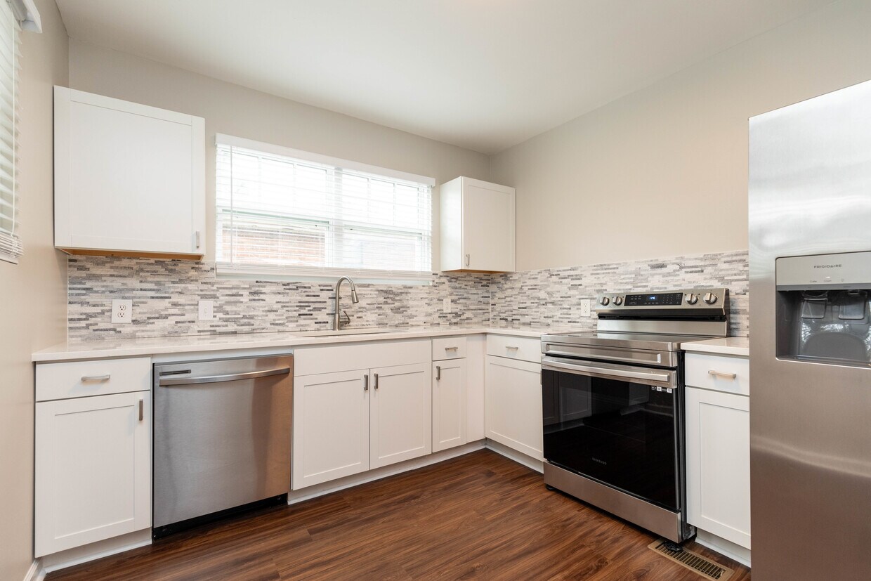Kitchen with stainless DW, stove, refrigerator and garbage disposal. - 848 Argle Ave