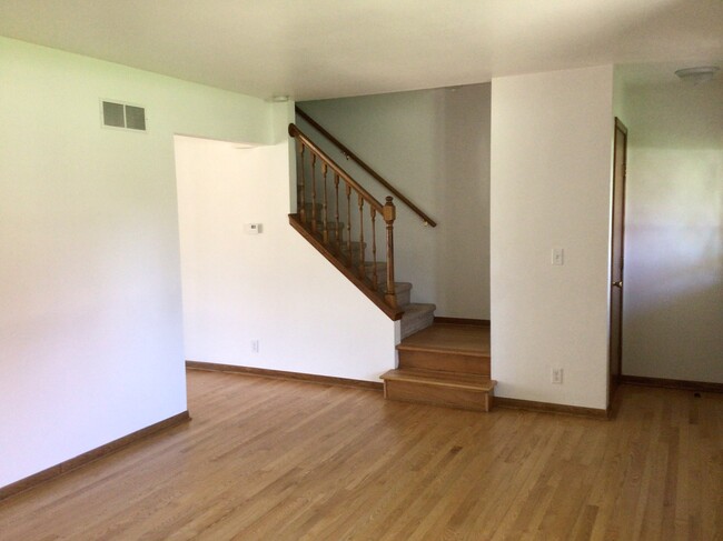 Stairway to upstairs off living room - 1056 S Imperial Dr