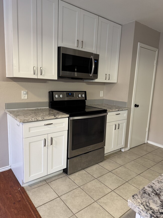 Tile floor in kitchen - 335 Fantail Loop