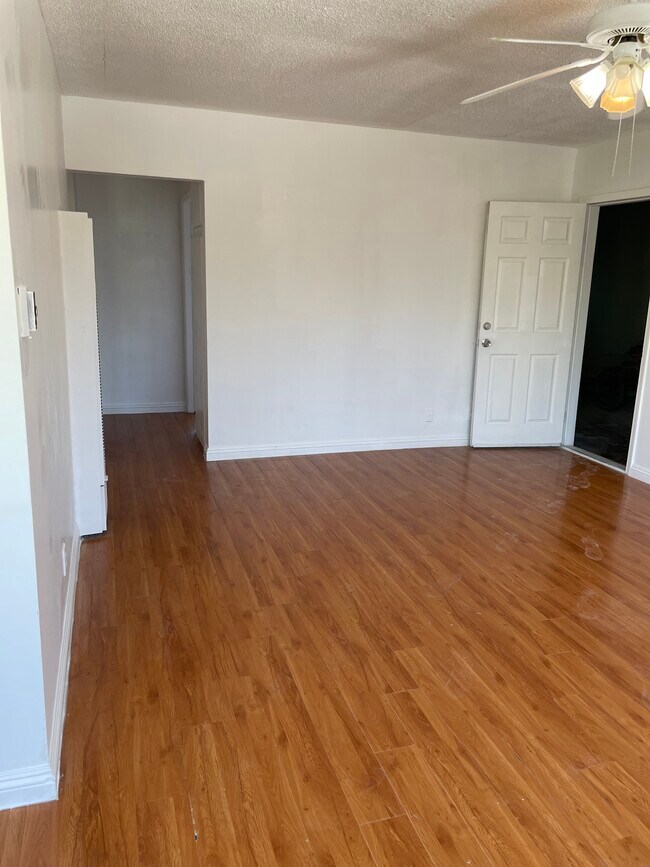 living room opens to garage on right - 25148 Ebony Ln