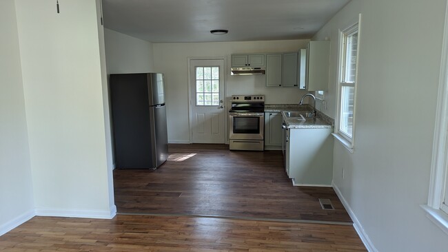 Open style kitchen connected to living area - 36 Montis Dr