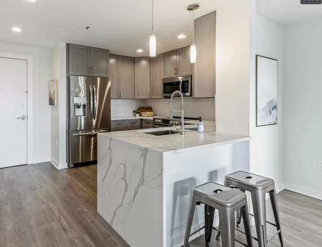 Kitchen with breakfast countertop - 80 E Milton Ave