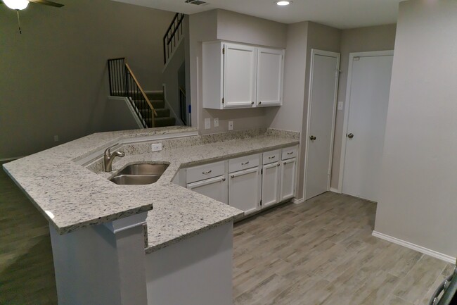 Kitchen with Granite and Stainless Appliances - 12905 Modena Trail