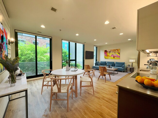 Dining / living with view of courtyard;; kitchen at right - 57 N St NW
