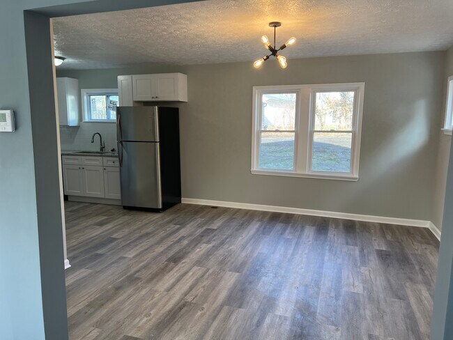 Open floor layout from kitchen into dining room is perfect for entertaining - 3253 Silsby Rd