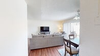 This well-designed apartment offers 1060 square feet of comfortable living space on a single floor. The layout includes three bedrooms, two bathrooms, a kitchen, laundry room, and additional living areas. The primary bedroom is generously sized at 190 square feet, providing ample space for relaxation.

The kitchen is a standout feature, boasting wooden cabinetry, stainless steel appliances, and a practical layout. It includes a dishwasher and full-sized refrigerator, making meal preparation and cleanup efficient. The laundry room is conveniently located within the unit, equipped with a washer and dryer for added convenience.

Throughout the apartment, warm wood-look flooring creates a cohesive and inviting atmosphere. Large windows in the bedrooms and living areas allow for plenty of natural light, enhancing the sense of spaciousness. The bathrooms are well-appointed with vanities offering storage space and modern fixtures.

The bedrooms are comfortably sized, with the primary bedroom featuring an en-suite bathroom. Built-in closets provide valuable storage solutions. The overall design of the apartment emphasizes functionality and comfort, with neutral color schemes that allow for personalization. This thoughtfully laid-out space offers a harmonious blend of style and practicality for modern living.