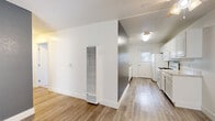 Located at 630 Magnolia Ave in Long Beach, California, this 2-bedroom, 2-bathroom unit offers a practical and well-designed single-floor layout. The open living area features light wood-style flooring, a textured ceiling, a ceiling fan, and a neutral color palette with a slate-blue accent wall that adds a touch of character. A wall-mounted heater unit serves the living space efficiently.

The galley-style kitchen is outfitted with white cabinetry, a gas range, refrigerator, double-basin sink, and a built-in microwave. A window at the end of the kitchen allows natural light to filter in, creating a bright and functional workspace.

Both bedrooms are carpeted and feature vertical blinds on windows that bring in natural light. Each bedroom includes a sliding-door closet with built-in shelving, offering organized storage. The primary bedroom provides a comfortable footprint with views of the surrounding greenery.

The two bathrooms are clean and consistent in design, each featuring wood-style flooring, a white vanity with a speckled countertop, a mirrored medicine cabinet, and updated fixtures. The overall aesthetic throughout the unit is clean, bright, and move-in ready, making it a practical home in a convenient Long Beach location.