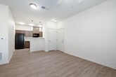 Located at 307 E Hawaii Ave in Nampa, Idaho, this single-story, one-bedroom, one-bathroom home offers a thoughtfully designed layout that maximizes every square foot of its compact footprint. Light-toned luxury vinyl plank flooring flows throughout the entire space, providing a cohesive and easy-to-maintain surface underfoot.

The living area is bright and airy, featuring a ceiling fan with light fixture, large windows dressed with blinds, and a glass-panel door that leads to a private patio—allowing generous natural light to fill the room. The bedroom is a comfortable size, with its own ceiling fan, a natural light-filled window, and access to well-organized closet space featuring double hanging rods and built-in shelving for efficient storage. Two additional closets provide ample space throughout the home.

The galley-style kitchen is efficiently laid out with warm-toned cabinetry, light stone-finish countertops, a double stainless steel sink, and black appliances including a range, microwave, and refrigerator. A dedicated pantry offers valuable additional storage. The bathroom features matching wood-tone cabinetry, a vanity with countertop, and a wall-mounted cabinet for extra organization. A separate patio extends the living space outdoors, completing this practical and move-in-ready home.