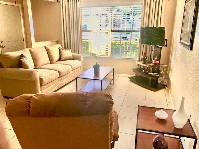 Furnished Living Room: Sofa, Recliner, Tables, TV - 113 Reserve Cir