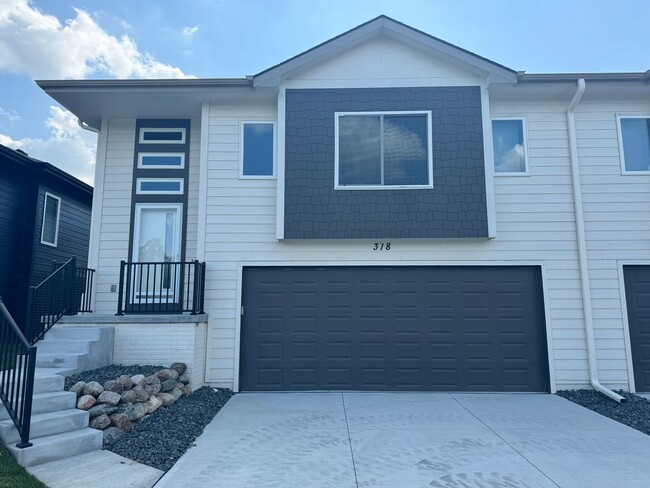 Building Photo - Luxury Bennington Townhome Ready For Move In