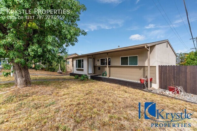 Building Photo - Lovely, updated home with large yard and A/C