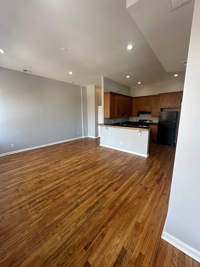 Large living/dining room with REAL hardwood floors recently refinished - 1426 Madison Ave