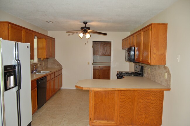 Kitchen to Laundry and entry from garage - 2762 E Travis St